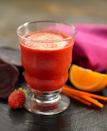 Sinaasappelsap met aardbeien