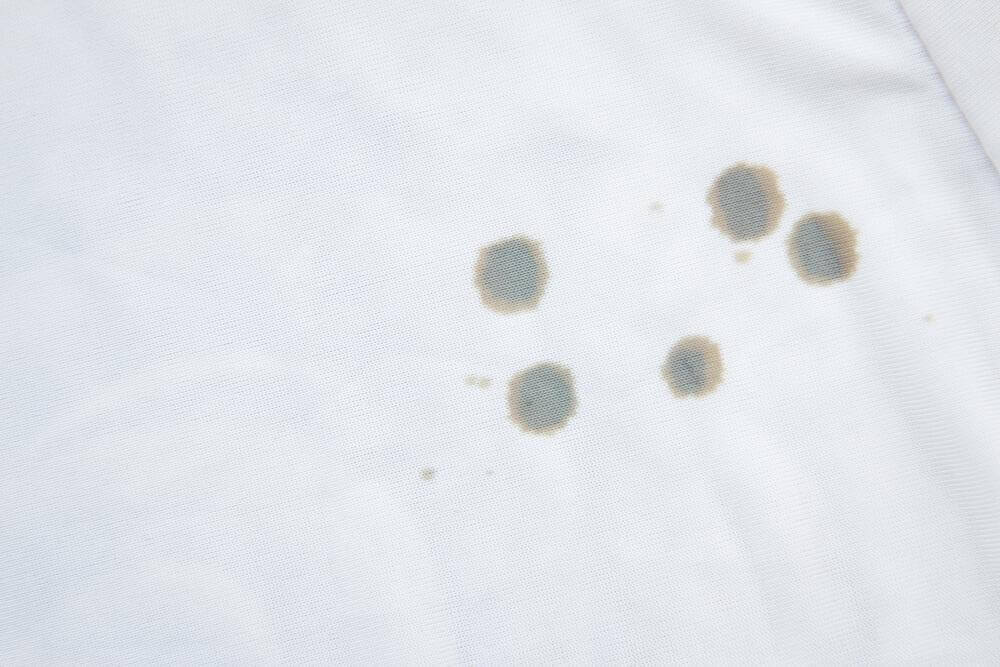 Olievlekken uit kleding verwijderen