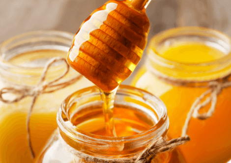 Honingpotten met honingdipper